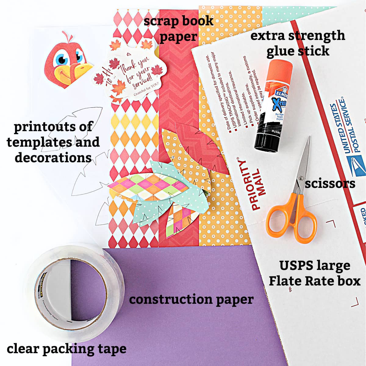 Materials: decoration printouts, glue stick, scissors, box, clear packing tape, construction paper, scrap book paper.
