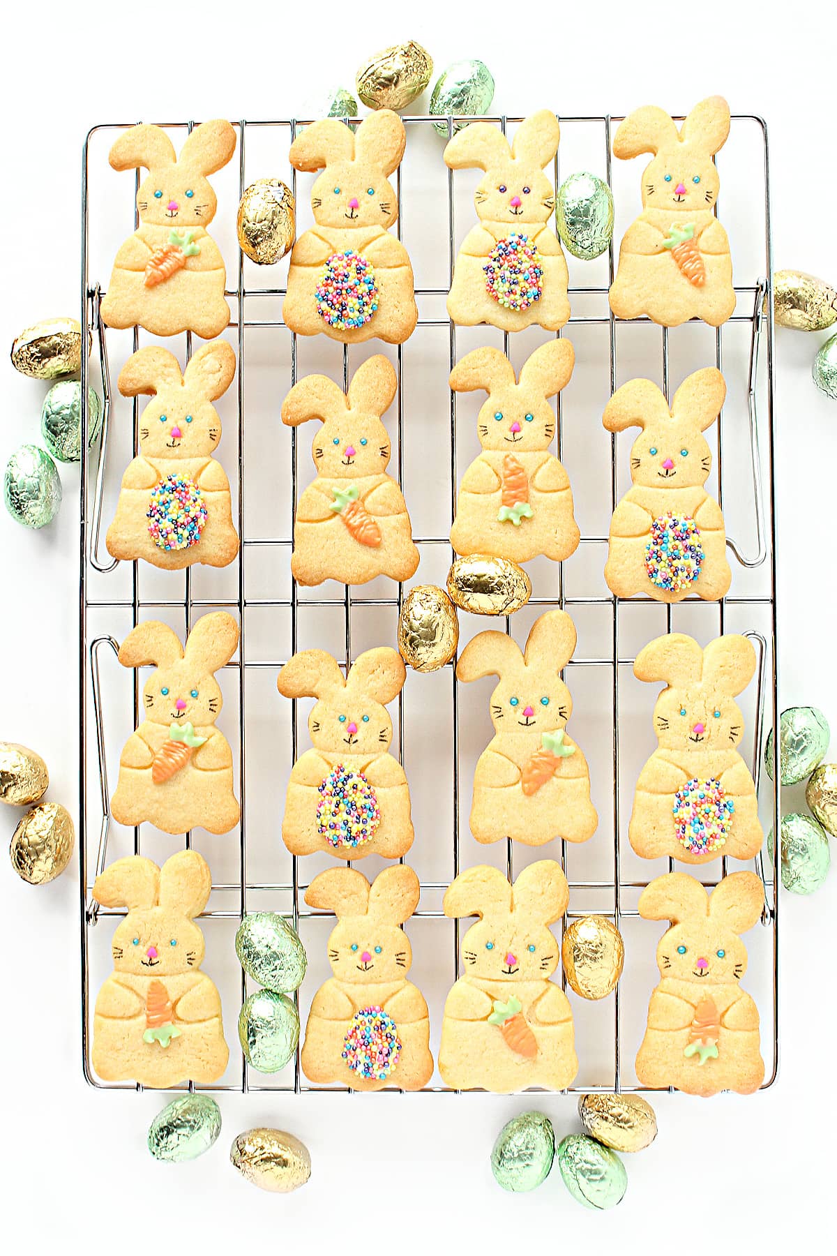 Cutout Bunny Cookies decorated with candy melt carrots or Easter Eggs.