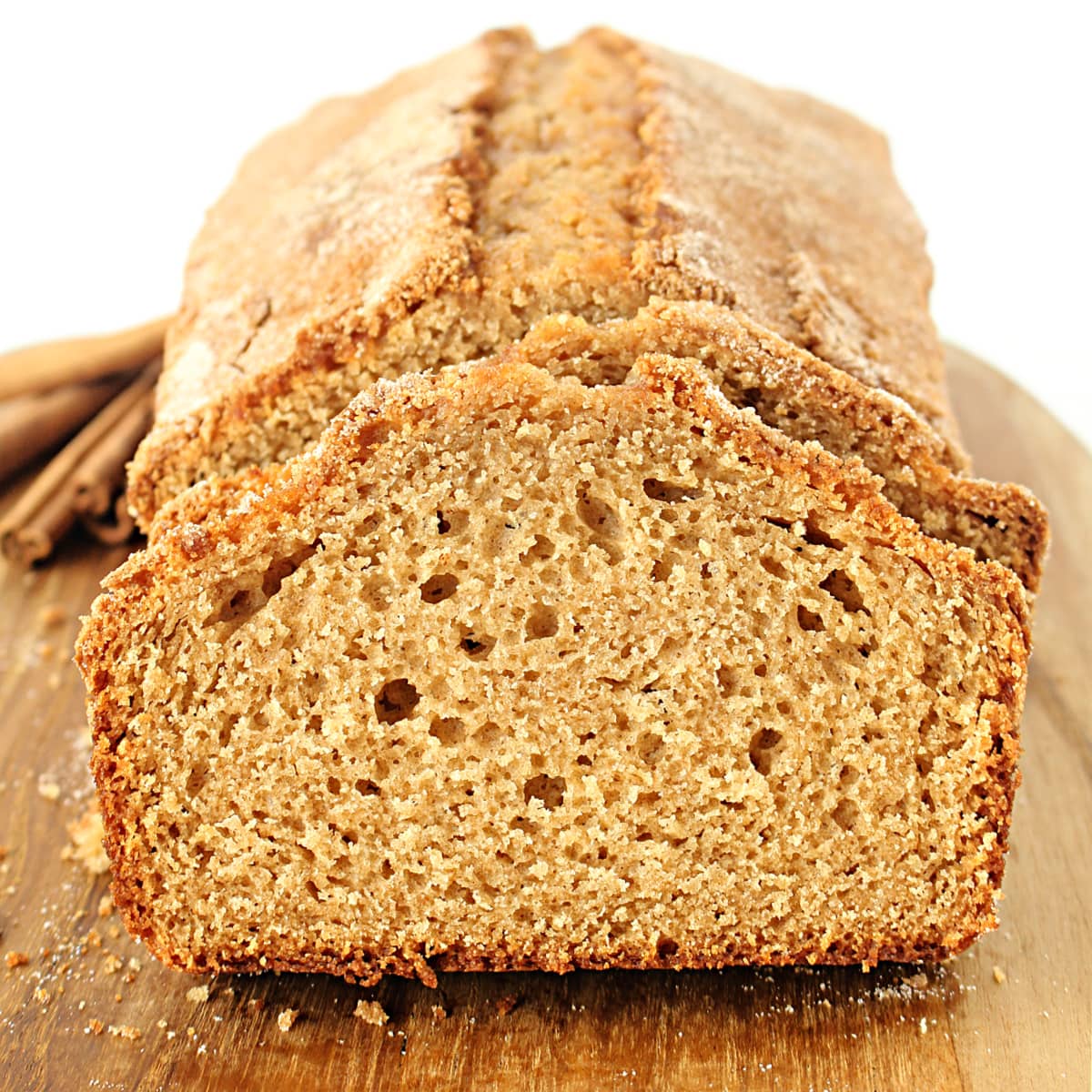 Closeup of a slice of fluffy cinnamon quick bread.