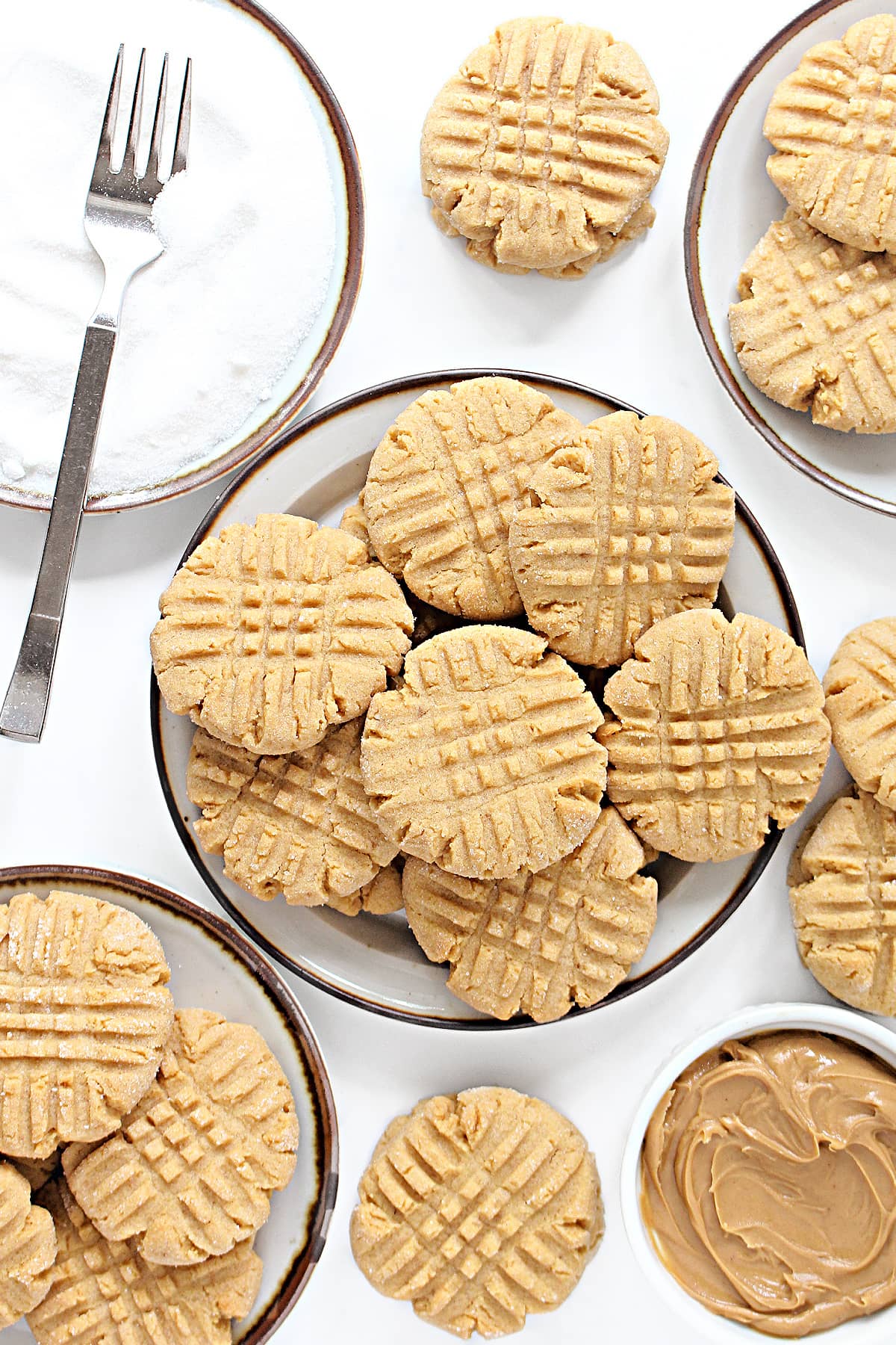 Peanut Butter Cookies with a criss cross pattern from a fork on top.