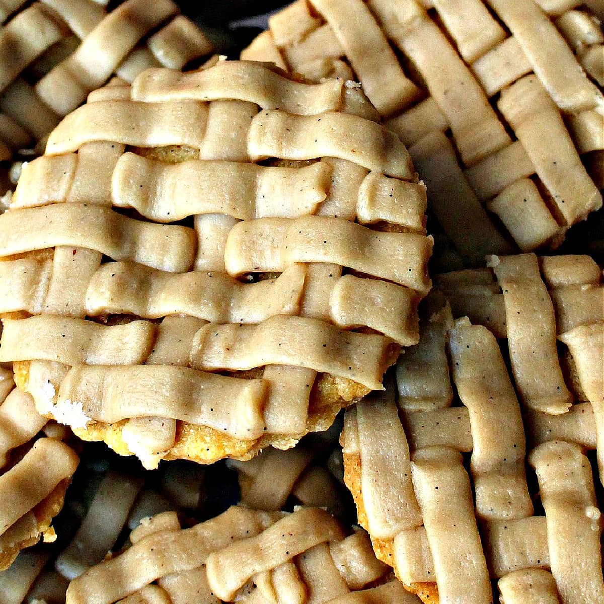 Closeup of lattice look icing on top of pumpkin pie cookies.