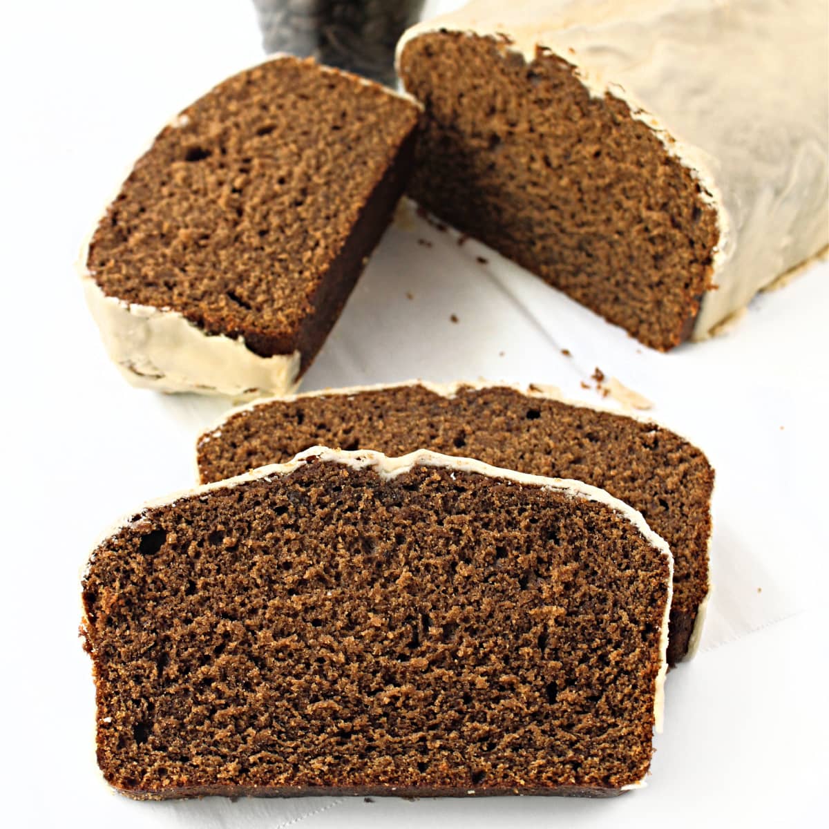 Closeup slices of sliced coffee loaf showing soft crumb.