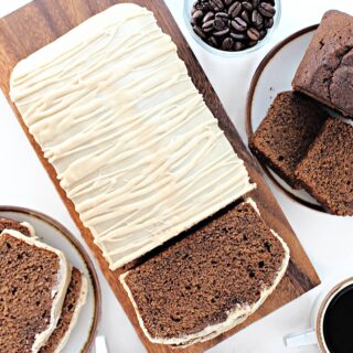 Dark brown coffee loaf cake topped with coffee icing.