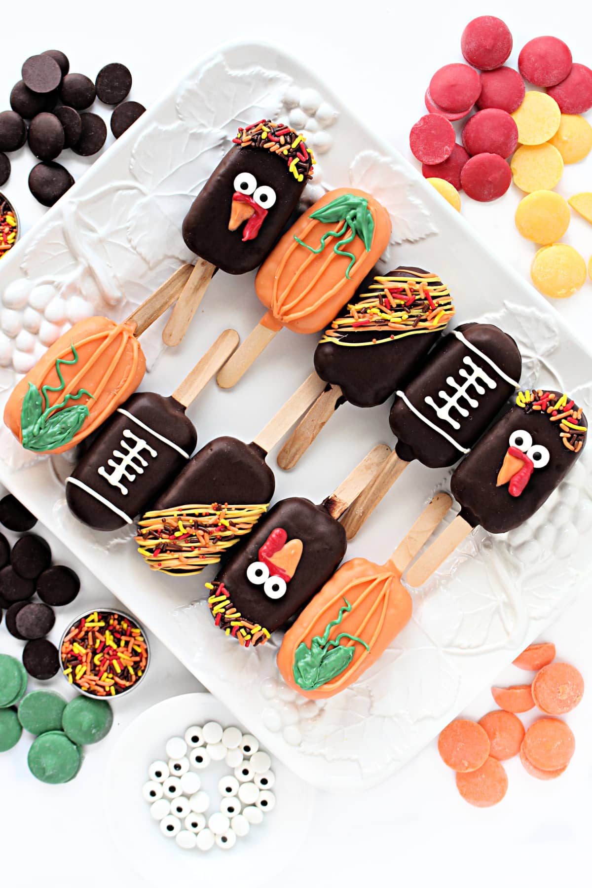 Chocolate coated Peanut Chews Candy Pops decorated like turkeys, pumpkins, and footballs.
