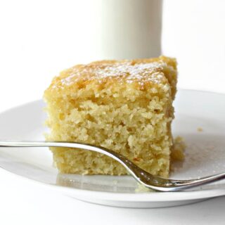 Closeup of a cut square of cake showing fluffy curmb.