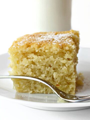 Closeup of a cut square of cake showing fluffy curmb.