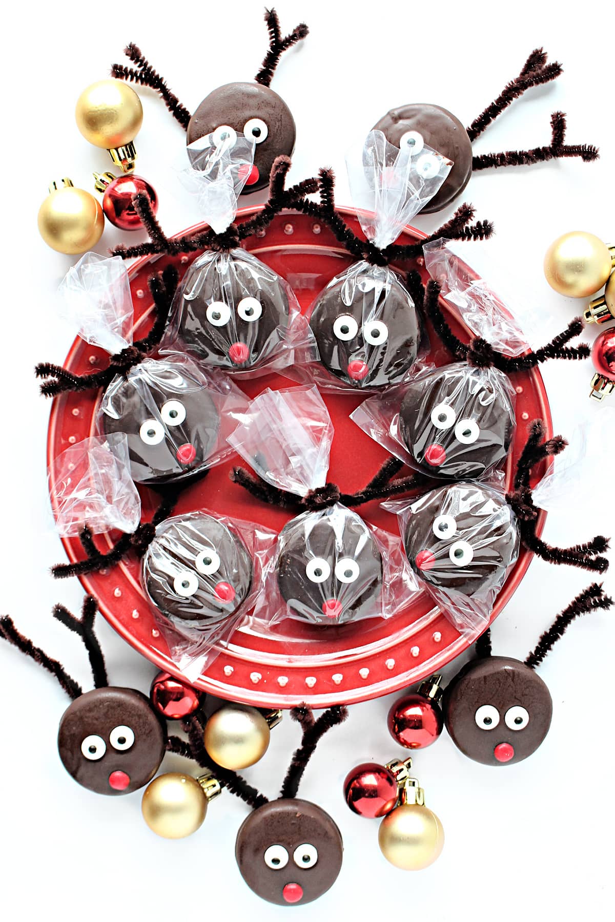 Chocolate dipped Oreos with candy eyes and a red candy nose to look like Rudolph.