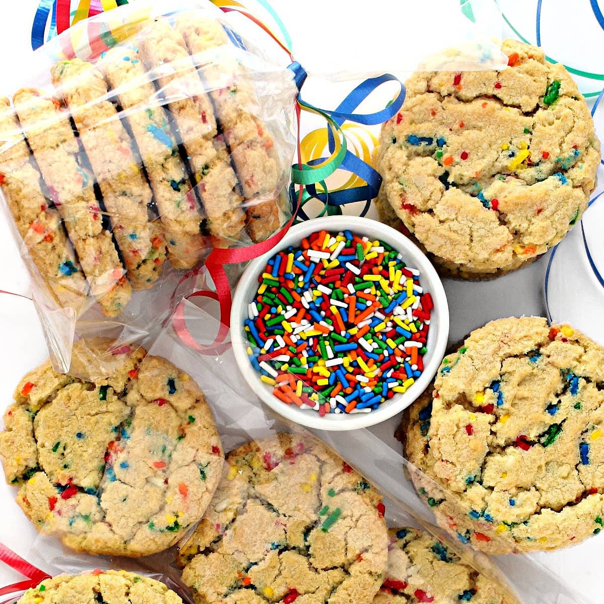 Closeup of Confetti Cookies with sprinkles in the dough being packaged in cellophane bags.