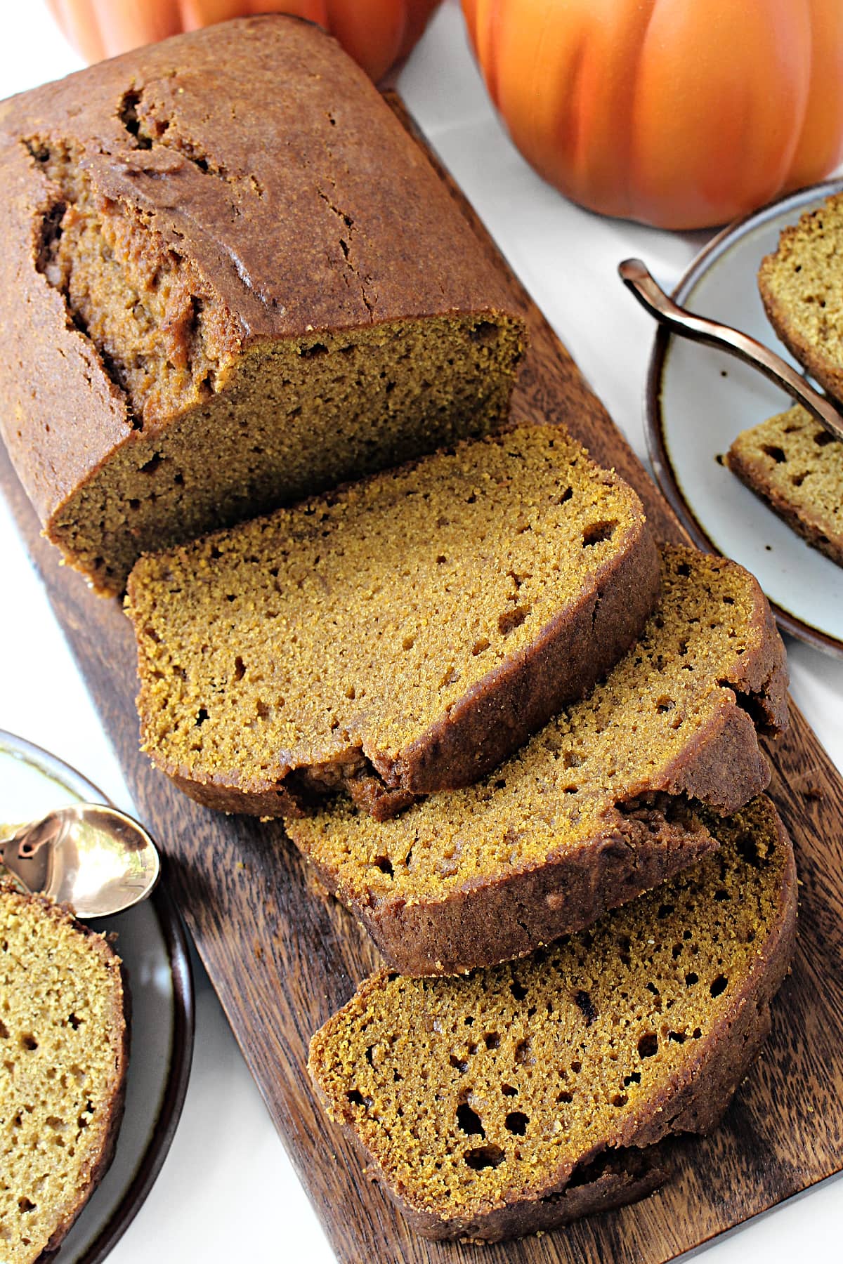 Sliced loaf of Pumpkin Bread showing the moist, dense crumb inside.