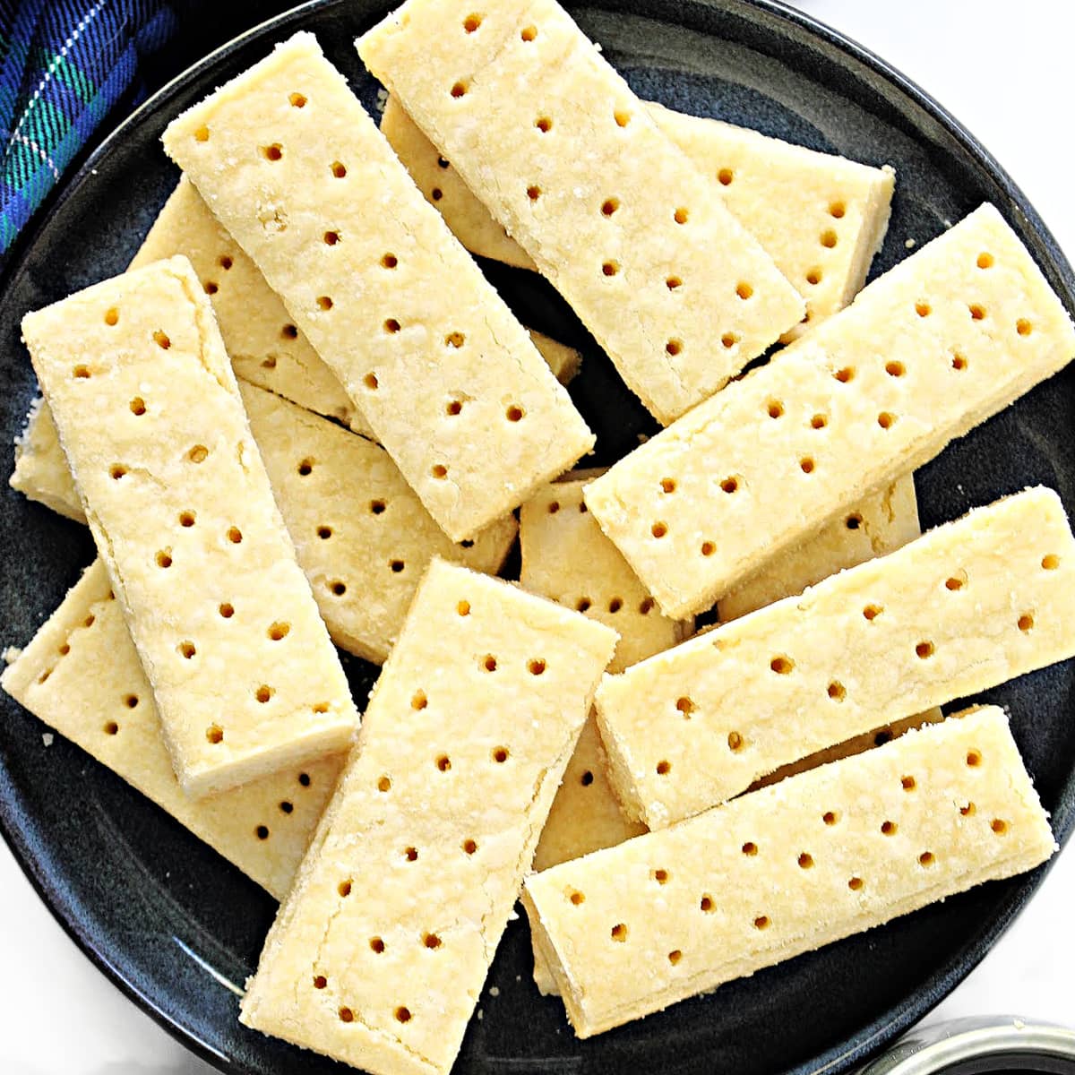 Closeup of tops of shortbread fingers with docking holes.