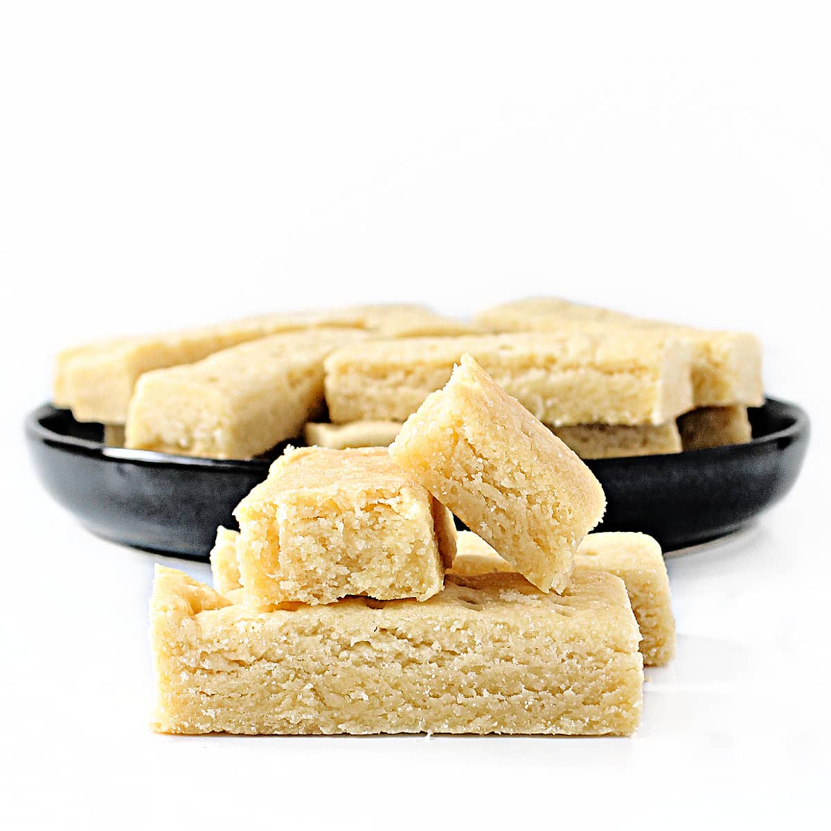 Closeup of shortbread cookie edges showing dense, buttery crumb.