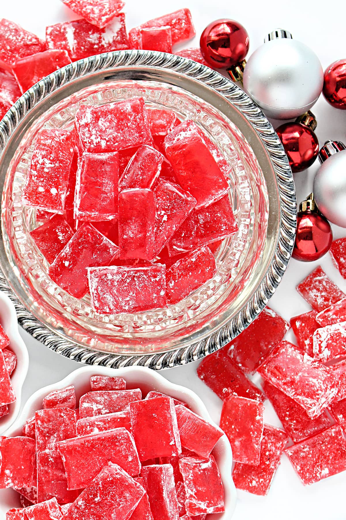 Red rectangles of Cinnamon Hard Candy in a crystal candy dish.