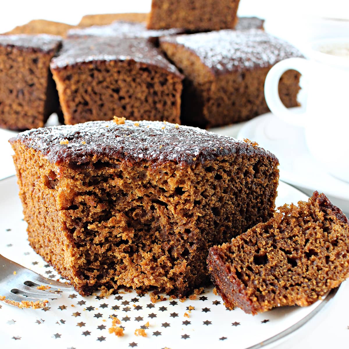 Closeup of fluffy Gingerbred Snack Cake on a plate.