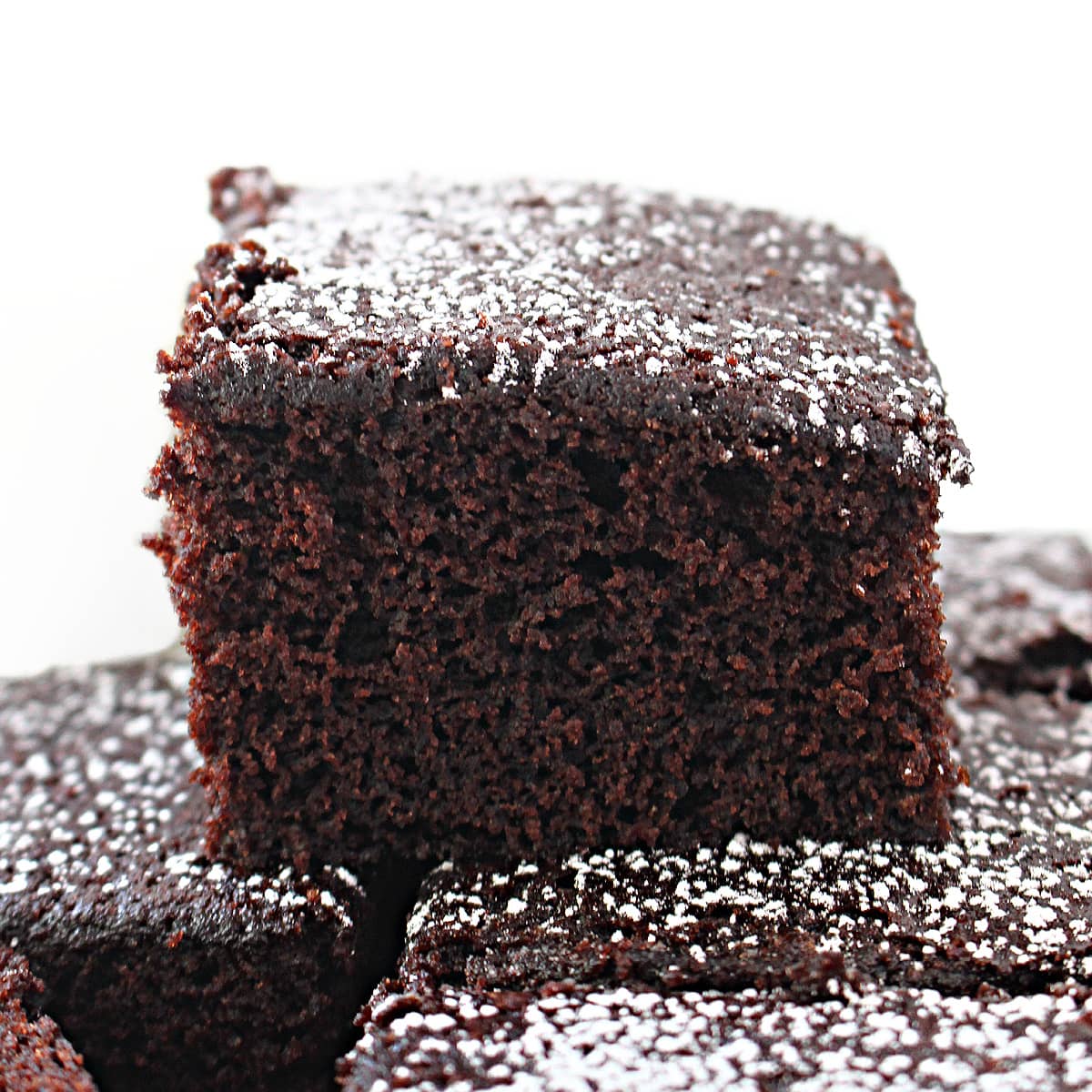 Closeup of a square of Chocolate Snack Cake showing the fluffy texture.