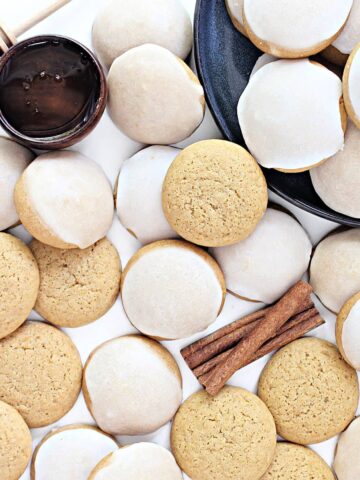 Thick, cake like Honey Cookies, some with a coating of white, lemon scented icing on top.