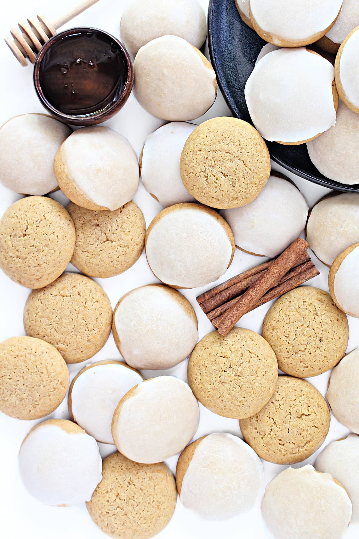 Puffy, mound shaped, spiced Honey Cookies topped with a thin coating of lemon icing.